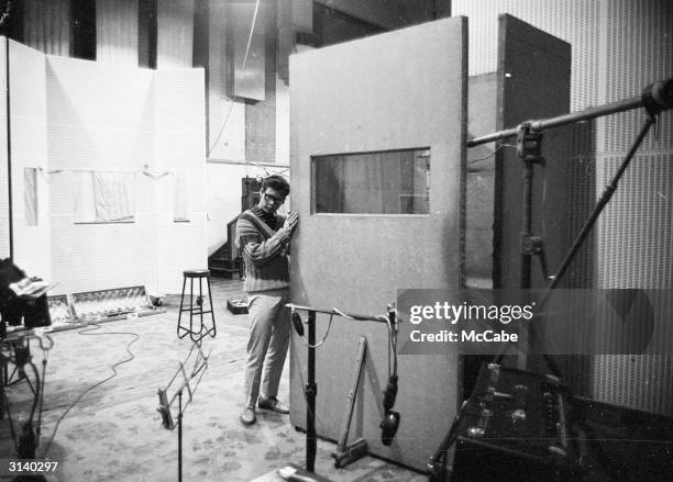 English singer Cliff Richard at the EMI recording studios.