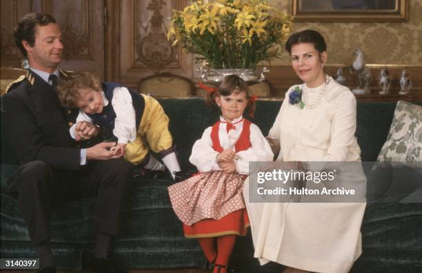 King Carl XVI Gustav of Sweden with Queen Silvia and their children Crown Princess Victoria and Prince Carl Philip on his 36th birthday.