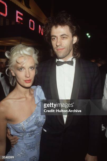 Pop singer Bob Geldof of the ' Boomtown Rats' with girlfriend Paula Yates at the premiere of 'A View to a Kill' a Bond film starring Roger Moore.