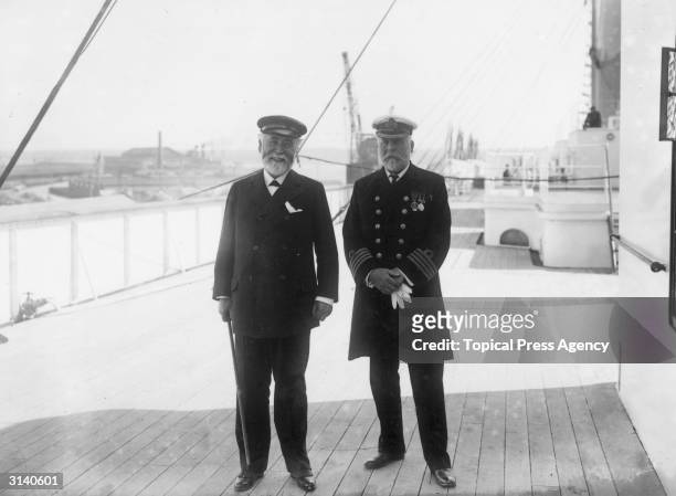 Captain John Smith and Lord James Pirrie, Chairman of the Harland & Wolff Shipyard, on the deck of the White Star Liner 'Olympic'. Captain Smith...