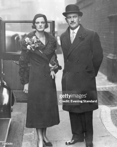 Major-General Sir Stewart Menzies , head of the British Secret Service during WW II, with his bride Pamela, daughter of the Hon Rupert Beckett. It is...
