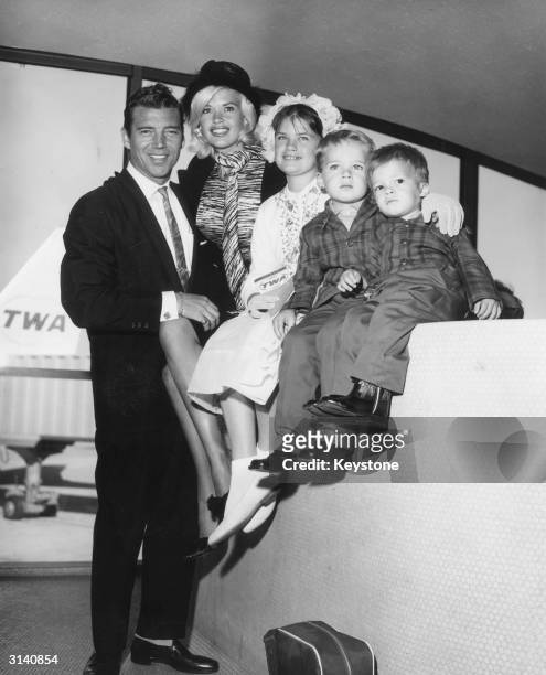 Hollywood sex symbol Jayne Mansfield and her family arrive at New York International Airport from Los Angeles, en route to Rome for the filming of...