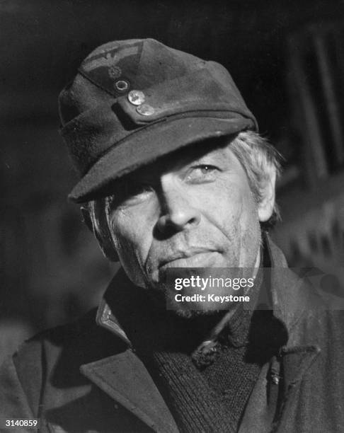 American actor James Coburn plays Sergeant Steiner in the wartime drama 'Cross of Iron', directed by Sam Peckinpah.