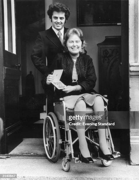 British cellist Jacqueline Du Pre leaves Buckingham Palace with her husband, pianist Daniel Barenboim, after receiving an OBE from the Queen. She...