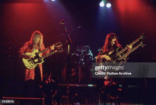 Canadian rock band Rush take the stage fronted by guitarist Alex Liefson with singer and bassist Geddy Lee.