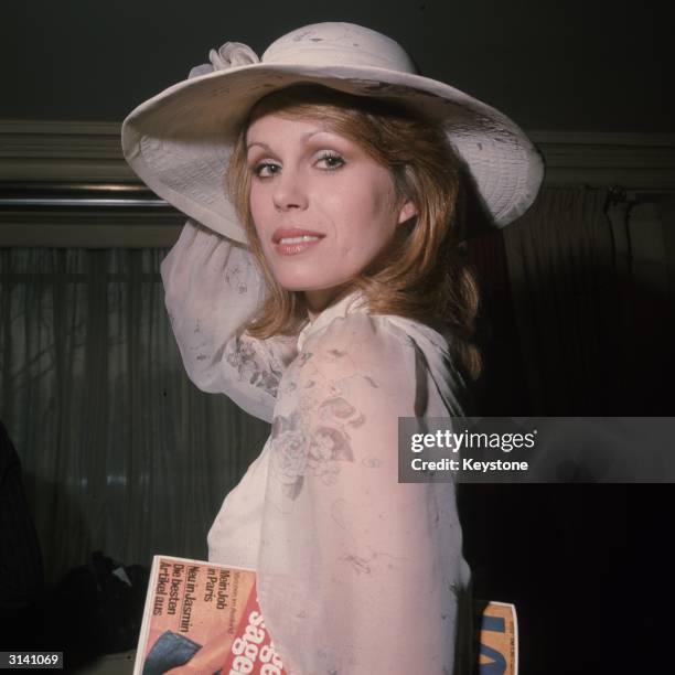 British model and actress Joanna Lumley, star of the TV series 'The New Avengers', wearing a summery blouse and hat.