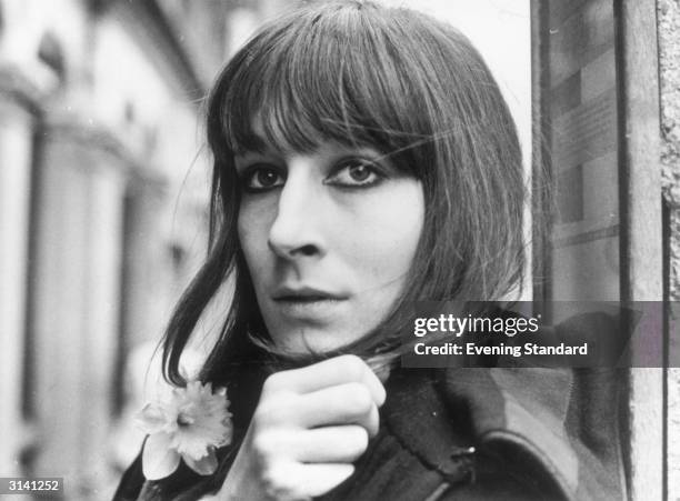 Film actress Anjelica Huston with a daffodil in her buttonhole.