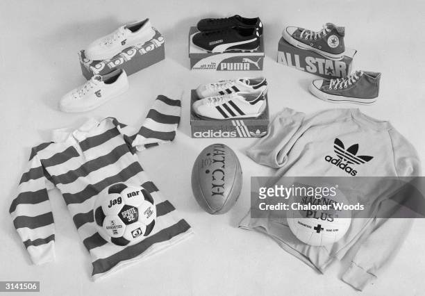 Football and rugger shirts and balls with trainers and sports shoes. Puma, Adidas, All Star are some of the brands.