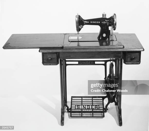 Singer sewing machine table with a foot pedal. Graham & Gillies.