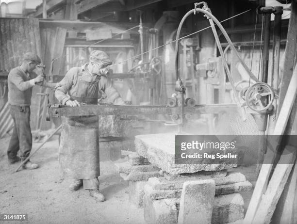 Workers at Carnsew Quarry, Penryn, Cornwall, owned by John Freeman & Co., cutting Cornish granite into blocks for shipping to London where it is...