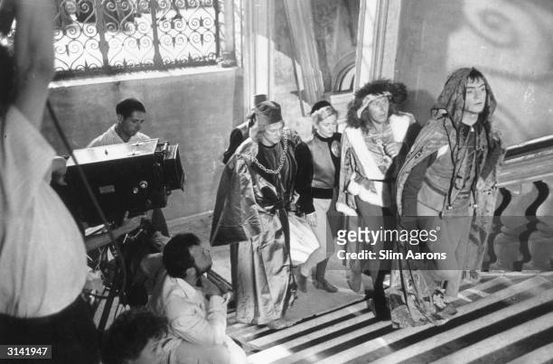 The cast and crew of 'Othello', directed by Orson Welles , on location in Venice. Orson, who is kneeling below the camera, also stars in the film.