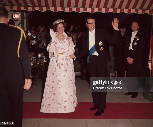 King Baudouin of Belgium and his wife Queen Fabiola arrive at the Belgian Embassy for a banquet during a state visit.