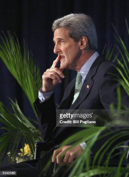Democratic presidential candidate and U.S. Senator John Kerry sits while listening to his introduction prior to speaking at Wayne State University...