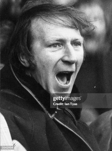 English football coach Jackie Charlton shouting encouragement at his second division team, Middlesborough, during a home match.