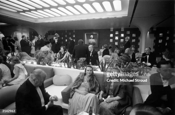 Passengers in the VIP lounge aboard the QE2 luxury liner.
