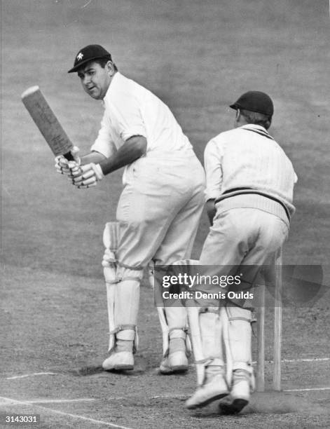 Kent captain, Colin Cowdrey , turns a delivery from Lance Gibbs of Warwickshire during his side's second innings on the last day of a three day...