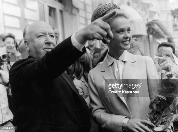 Alfred Hitchcock and American actress Tippi Hedren explore Cannes together after the premiere of his latest thriller 'The Birds' in which she plays...