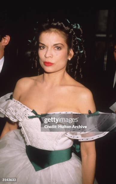 Model and human rights campaigner Bianca Jagger, wearing a Scarlett O'Hara style dress to a charity auction at Christies in aid of the AIDS Crisis...