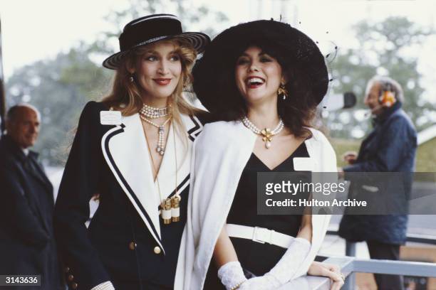 Hawaiian born model, Marie Helvin, with the American model and wife of Mick Jagger, Jerry Hall, at Royal Ascot.