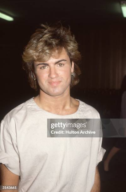 English pop star and one half of the duo 'Wham', George Michael, arriving at Heathrow Airport.