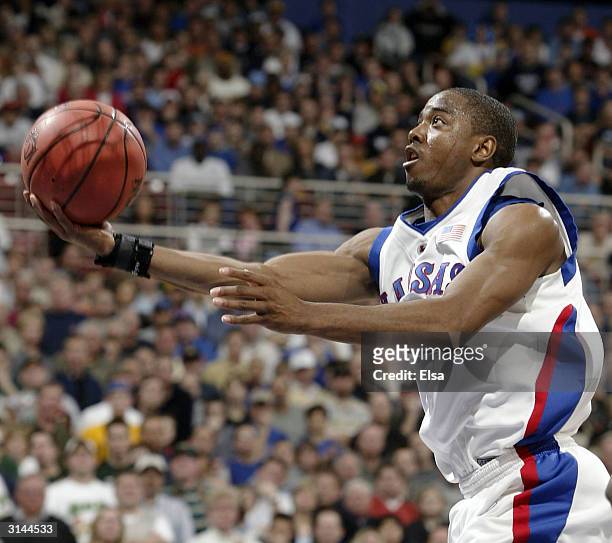 Aaron Miles of the Kansas Jayhawks goes up for two against the Alabama-Birmingham Blazers during the third round game of the NCAA Division I Men's...