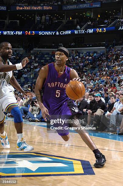 Jalen Rose of the Toronto Raptors drives against the New Orleans Hornets during the game at New Orleans Arena on March 21, 2004 in New Orleans,...