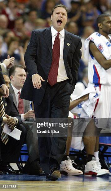 Head coach Bill Self of the Kansas Jayhawks directs his players against the Alabama-Birmingham Blazers during the third round game of the NCAA...