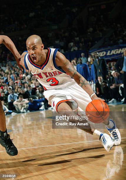 Stephon Marbury of the New York Knicks drives towards the basket against the Toronto Raptors on March 26, 2004 at Madison Square Garden in New York...