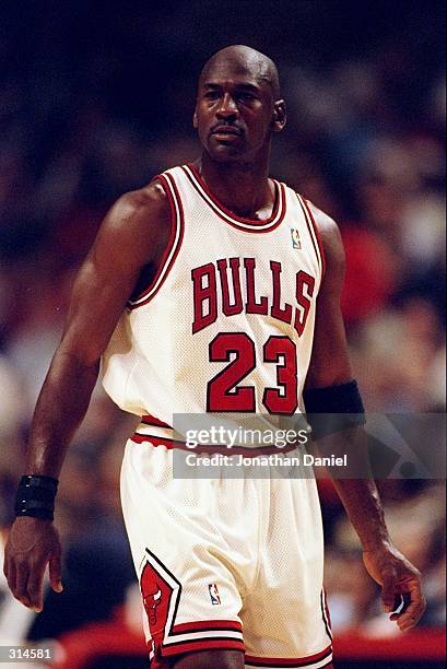 Guard Michael Jordan of the Chicago Bulls looks on during a game against the San Antonio Spurs at the United Center in Chicago, Illinois. The Bulls...