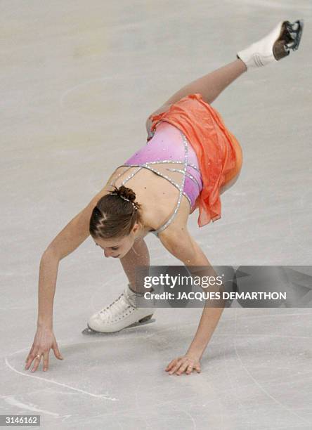 Carolina Kostner of Italy takes a fall during the Ladies Free Skating competition at the 2004 World Figure Skating Championships in Dortmund, 27...