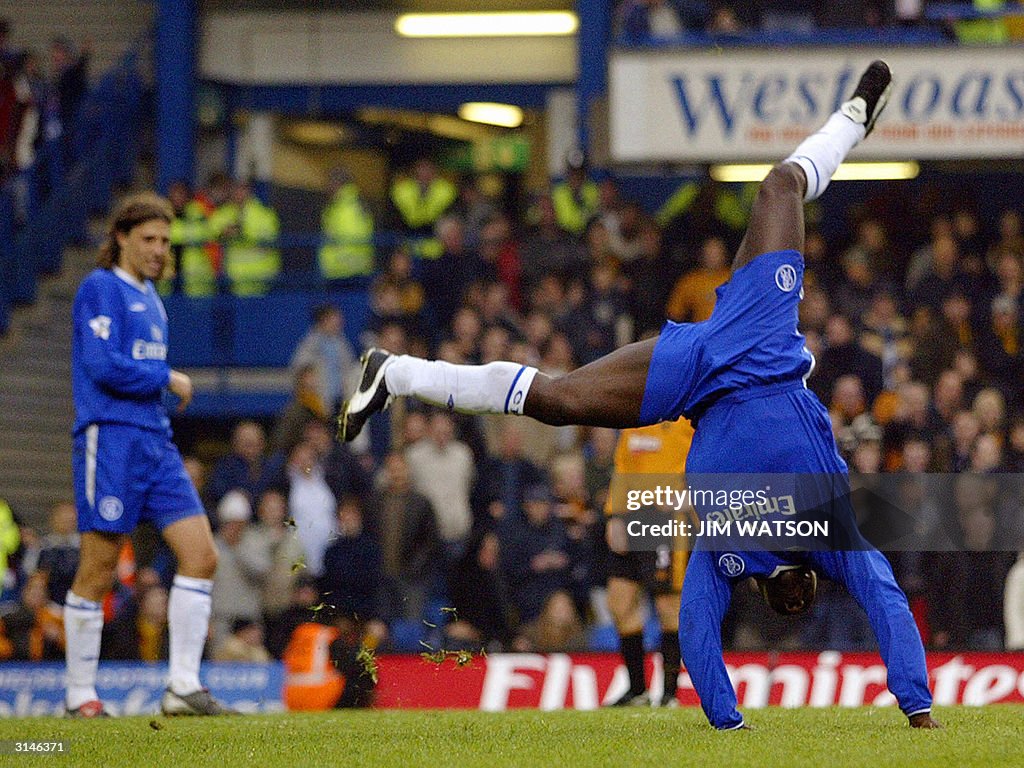 Chelsea's Jimmy Hasselbaink (R) does a c