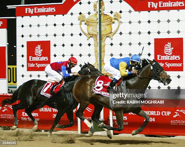 Jockey Alex Solis on Pleasantly Perfect wins ahead of fellow American Jerry Bailey on Medaglia d'Oro at the Dubai World Cup 27 March 2004. Pleasantly...
