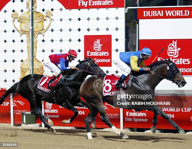 Jockey Alex Solis on Pleasantly Perfect wins ahead of fellow American Jerry Bailey on Medaglia d'Oro at the Dubai World Cup 27 March 2004. Pleasantly...