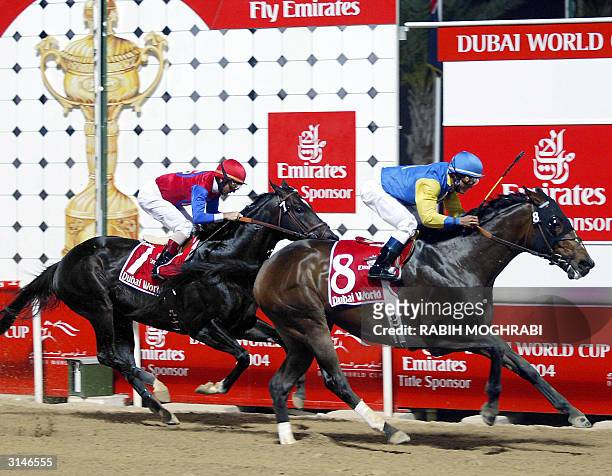 Jockey Alex Solis on Pleasantly Perfect wins ahead of fellow American Jerry Bailey on Medaglia d'Oro at the Dubai World Cup 27 March 2004. Pleasantly...