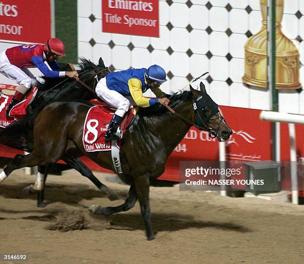 Jockey Alex Solis on Pleasantly Perfect wins ahead of fellow American Jerry Bailey on Medaglia d'Oro at the Dubai World Cup 27 March 2004. Pleasantly...