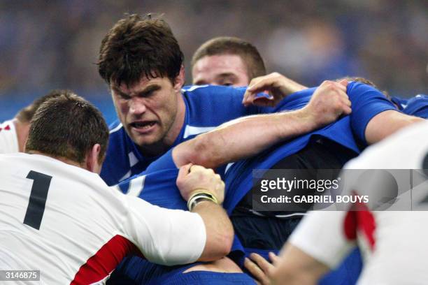 French lock and captain Fabien Pelous squares off during a ruck with England's prop Trevor Woodman during the Six Nations Rugby game between France...