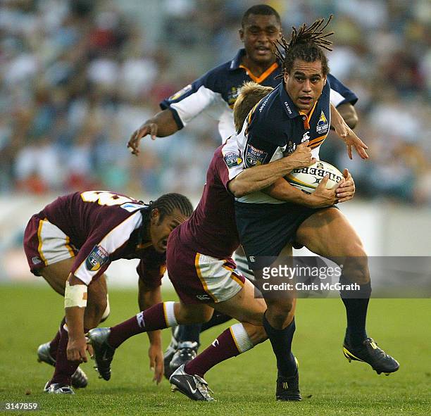George Smith of the Brumbies makes a break during the round six Tooheys New Super 12 Rugby between the ACT Brumbies and the Queensland Reds played at...