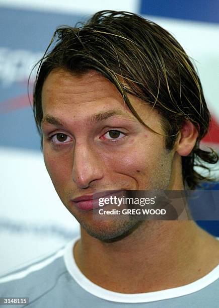 Australian swimmer Ian Thorpe reacts to a question during a media conference at the completion of day two of the Australian Olympic trials in Sydney,...