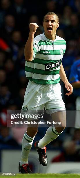Celtic's Henrik Larsson celebrates scoring the opening goal during the Scottish premier league match between Rangers and Celtic at Ibrox Stadium on...