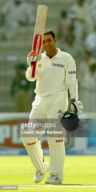 Virender Sehwag celebrates reaching his 200 during day one of the 1st Test Match between Pakistan and India at Multan Stadium on March 28, 2004 in...