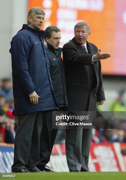 Manager Arsene Wenger of Arsenal argues with manager Sir Alex Ferguson of Manchester United during the FA Barclaycard Premiership match between...