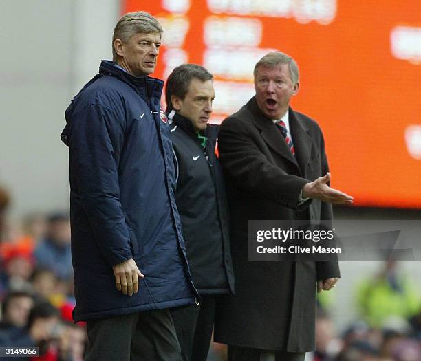 Manager Arsene Wenger of Arsenal argues with manager Sir Alex Ferguson of Manchester United during the FA Barclaycard Premiership match between...