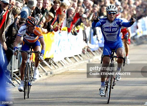 Italian Luca Paolini celebrates on the finish line as he wins the Brabantse Pijl cycling race ahead of Dutch Michael Boogerd , 28 March 2004, in...