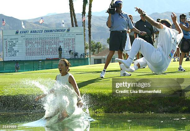 Grace Park and her caddie celebrate winning the Kraft Nabisco Championship at the Mission Hills Country Club March 28, 2004 in Rancho Mirage,...