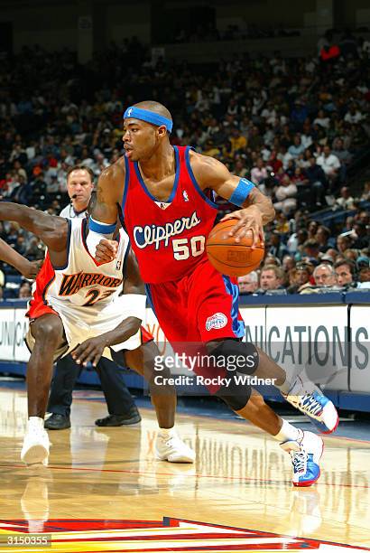 Corey Maggette of the Los Angeles Clippers drives the ball against the Golden State Warriors on March 28, 2004 at the Arena in Oakland in Oakland,...