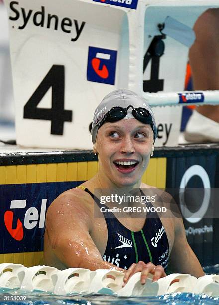 Australian swimmer Alice Mills smiles after winning her semi-final of the Women's 200m Individual Medley on day three of the Australian Olympic...