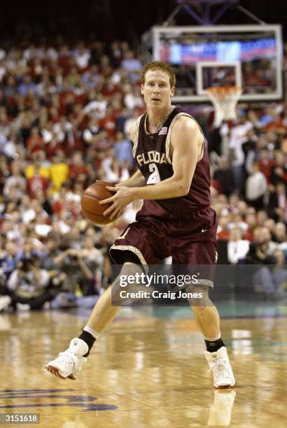 Andrew Wilson of the Florida State Seminoles moves the ball against the North Carolina State Wolfpack during the ACC Quarterfinal game on March 12,...