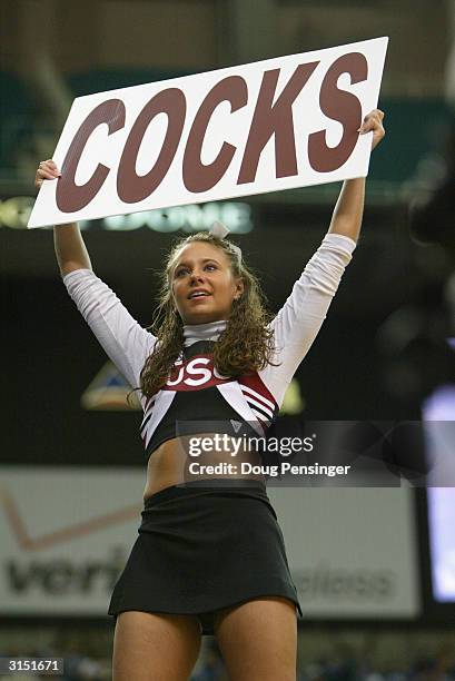 South Carolina Gamecocks cheerleader holds up a sign during the second round game of the SEC Men's Basketabll Tournament against the LSU Tigers on...