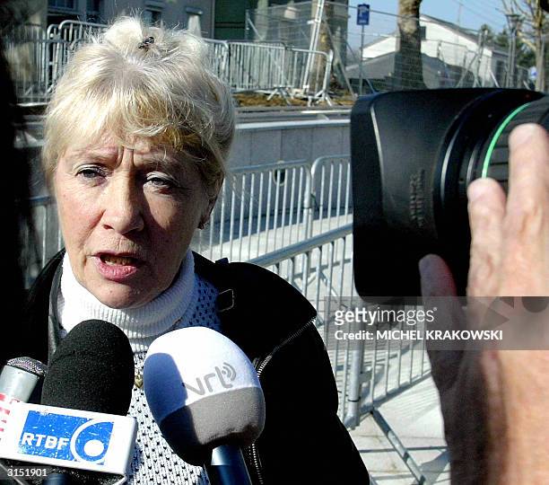 Francine Vergauwen, daughter of an elderly witness Marie-Louise Henrotte too sick to testify, arrives at the courthouse in the southeastern Belgian...