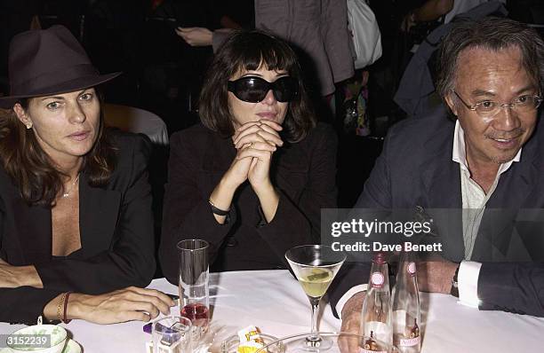 David Tang and wife Lucy and Annabel Nielsen attend the Frost French Fashion Show 2003 at the Royal Horticultural Hall on September 23, 2003 in...